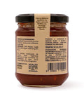 Retro del vaso da 230 grammi di Composta di Peperoncino Scalzo Calabria, con lista ingredienti e valori nutrizionali.